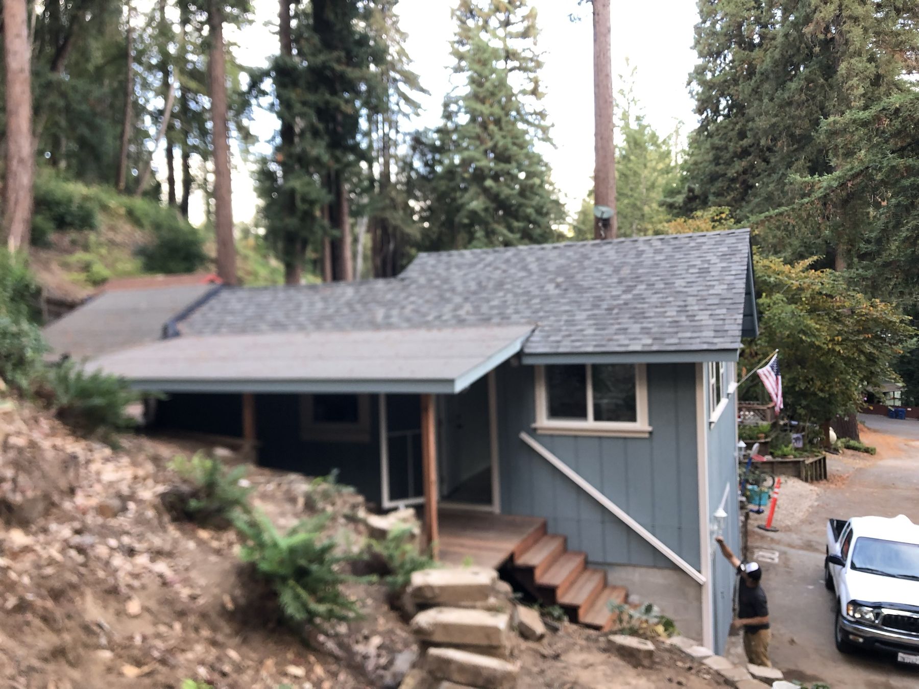 Same home fully rebuilt by EMC Construction with new roof, siding and stairs