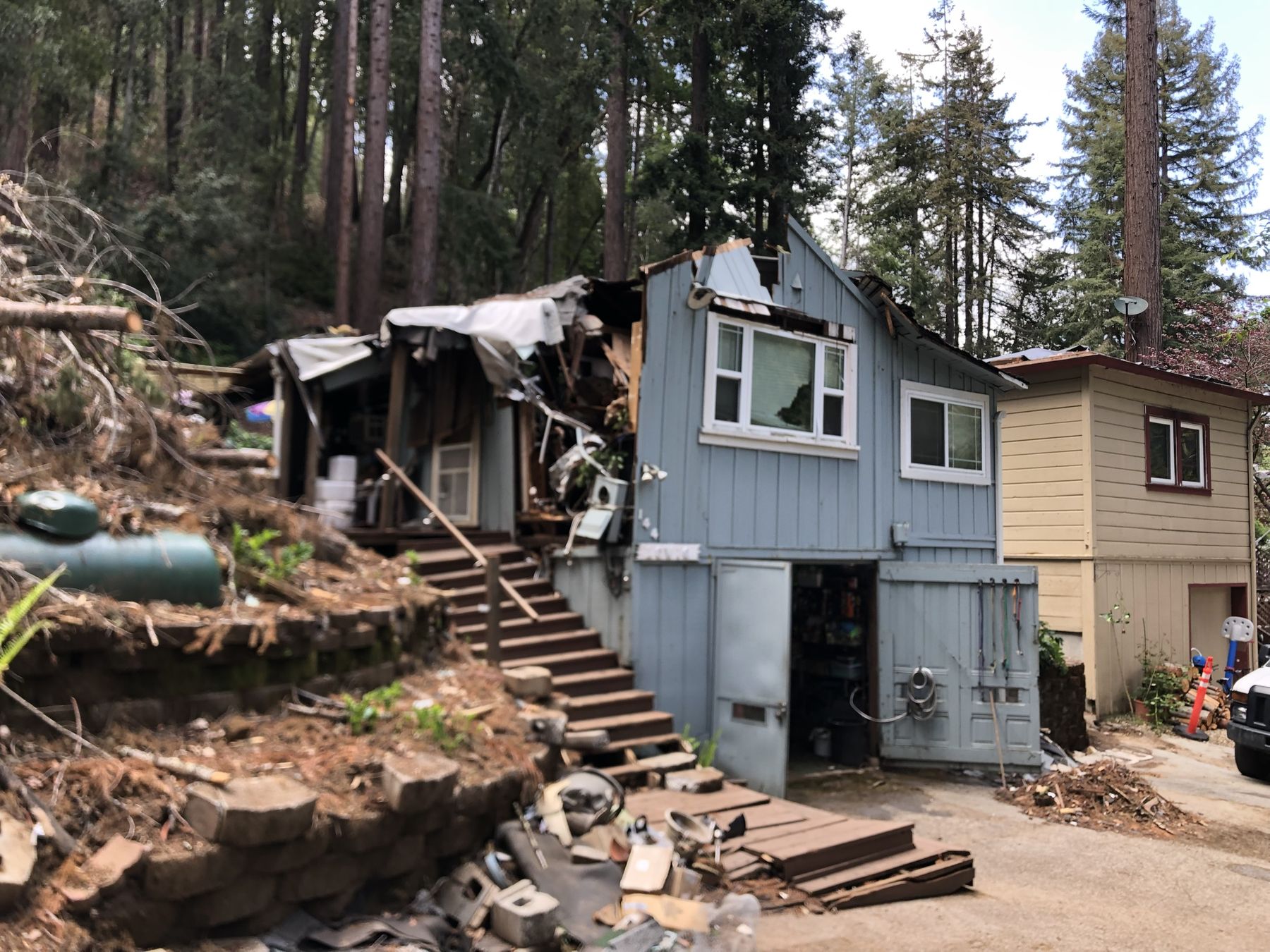 Home with severe tree and storm damage before EMC rebuild